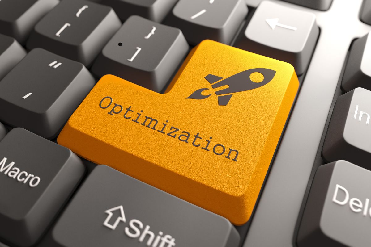 Keyboard key labeled "Optimization" with rocket icon representing SEO speed optimization