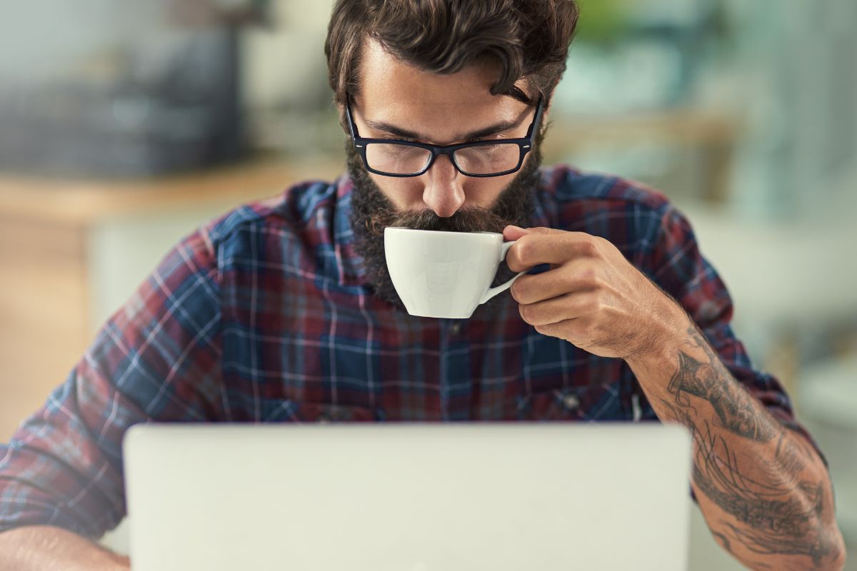 Attorney working with coffee while reviewing website design ideas
